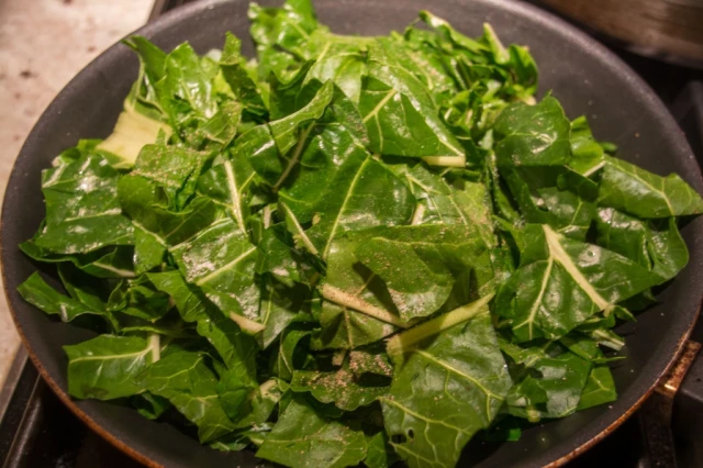 Raw Collard Greens Cooking in Pan